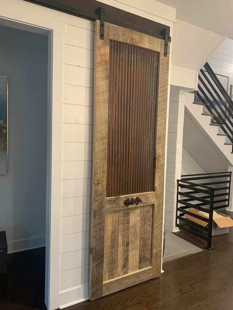 Sliding barn door to stairwell